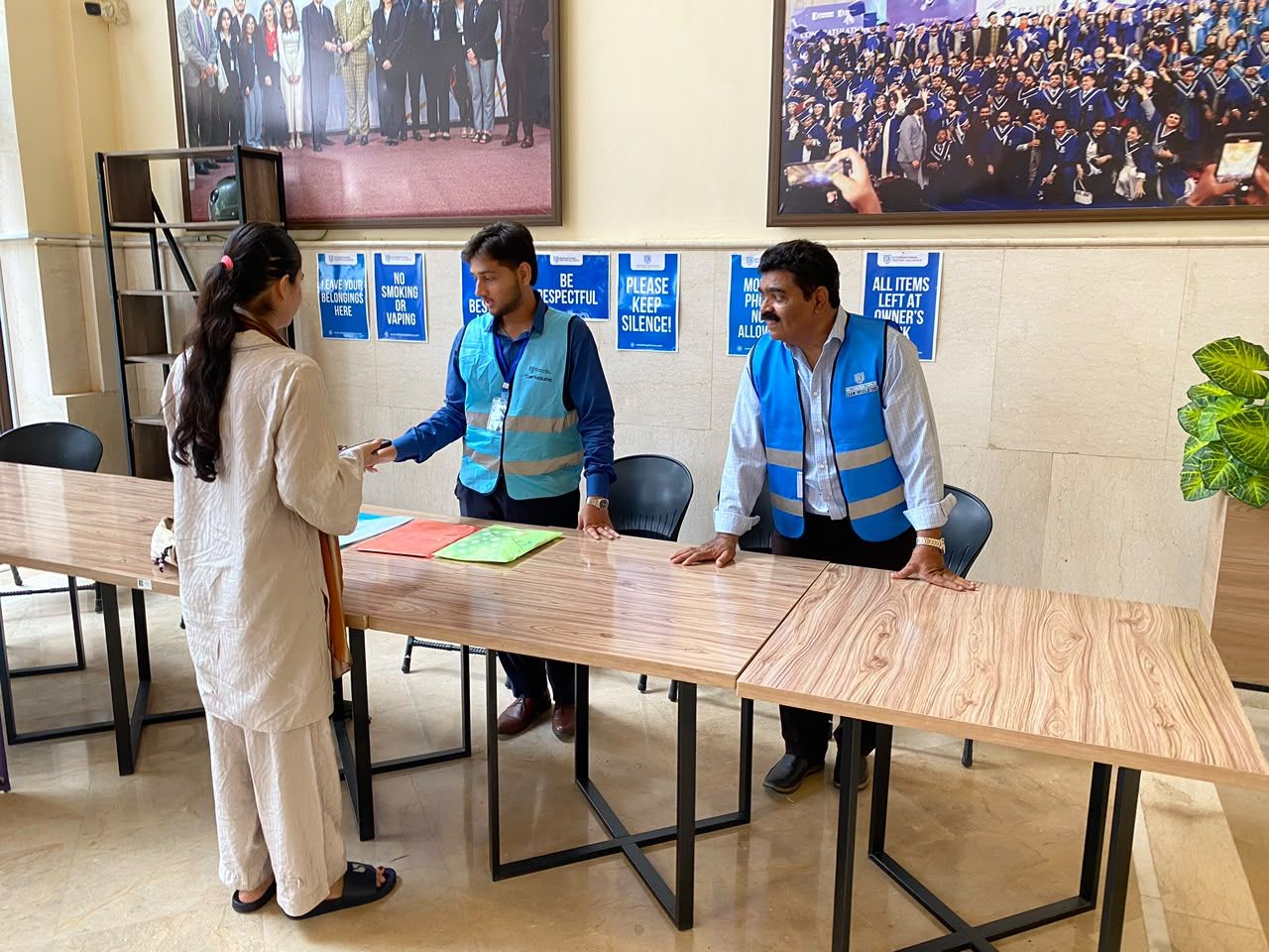 ITA staff helping a candidate at the registration desk